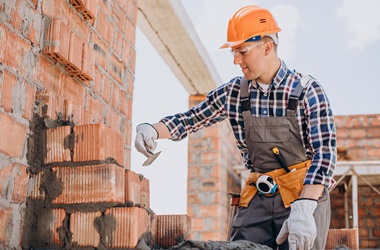 young craftsman building a house